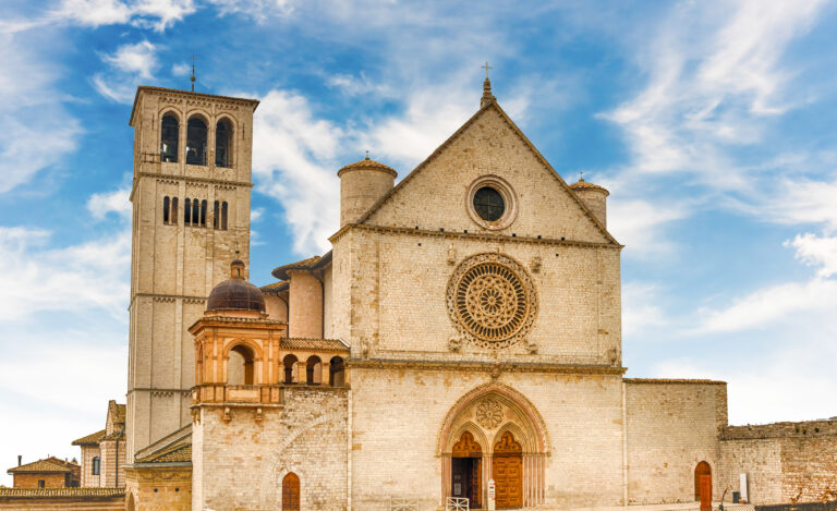 Facade of the Papal Basilica of Saint Francis of Assisi, one of the most important places of Christian pilgrimage in Italy. UNESCO World Heritage Site since 2000